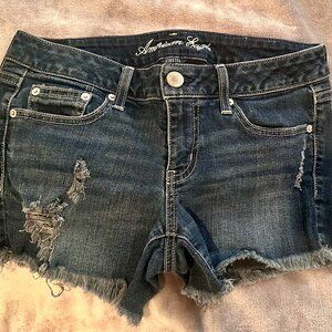 Dark blue, slightly distressed, cut off shorts